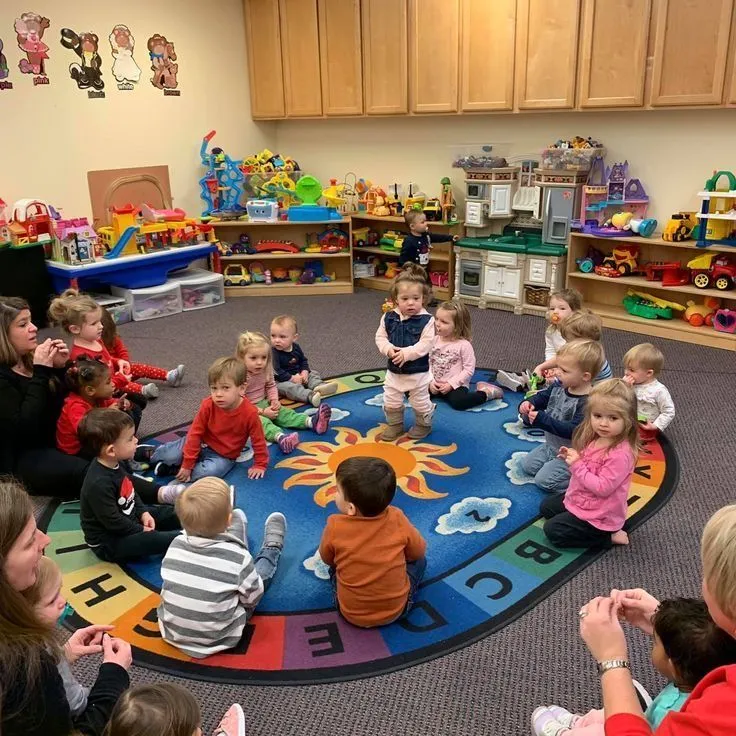 ABA therapist guiding group activity for children with autism in UK daycare