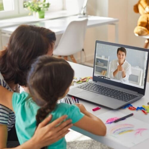 therapist guiding child online autism therapy UK session