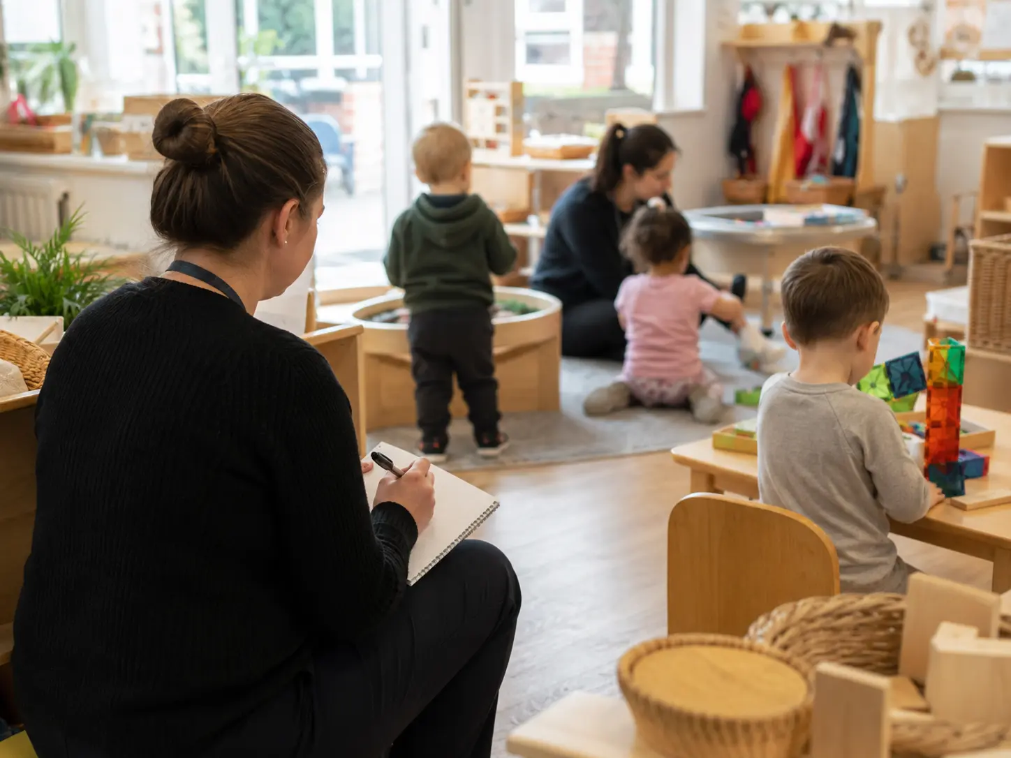 ABA Therapy at Daycare 2 Behaviour analyst observing a child during an ABA assessment in a nursery setting