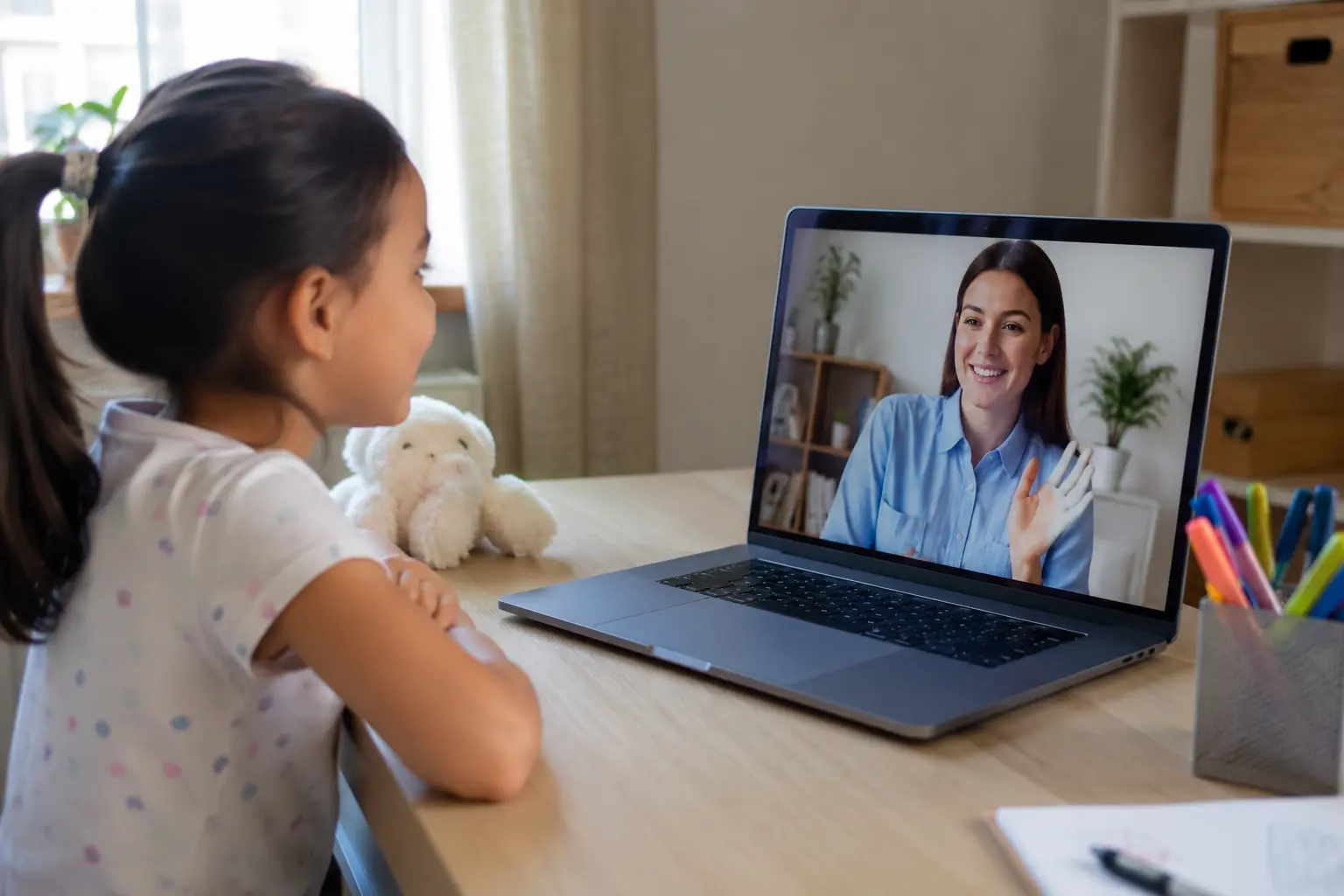 Home 8 Child attending a virtual ABA therapy session on a laptop
